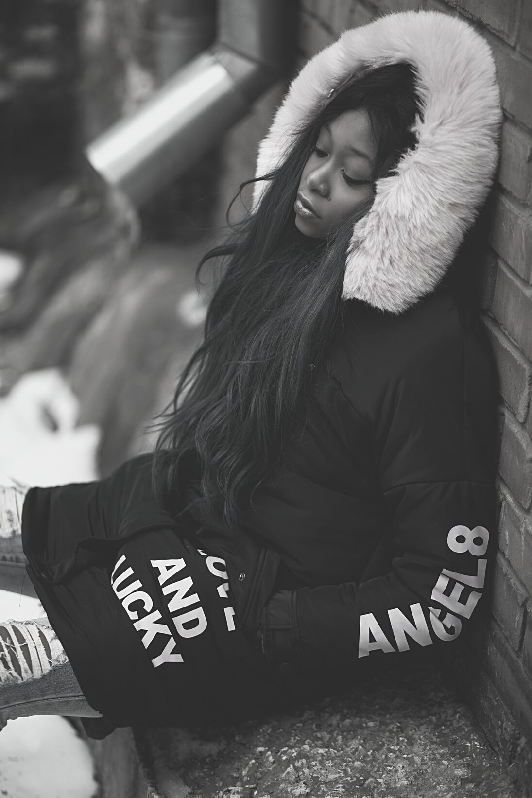 Woman Wearing Black and Pink Coat Leaning on Wall